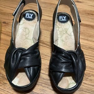 Black leather women’s slip ons